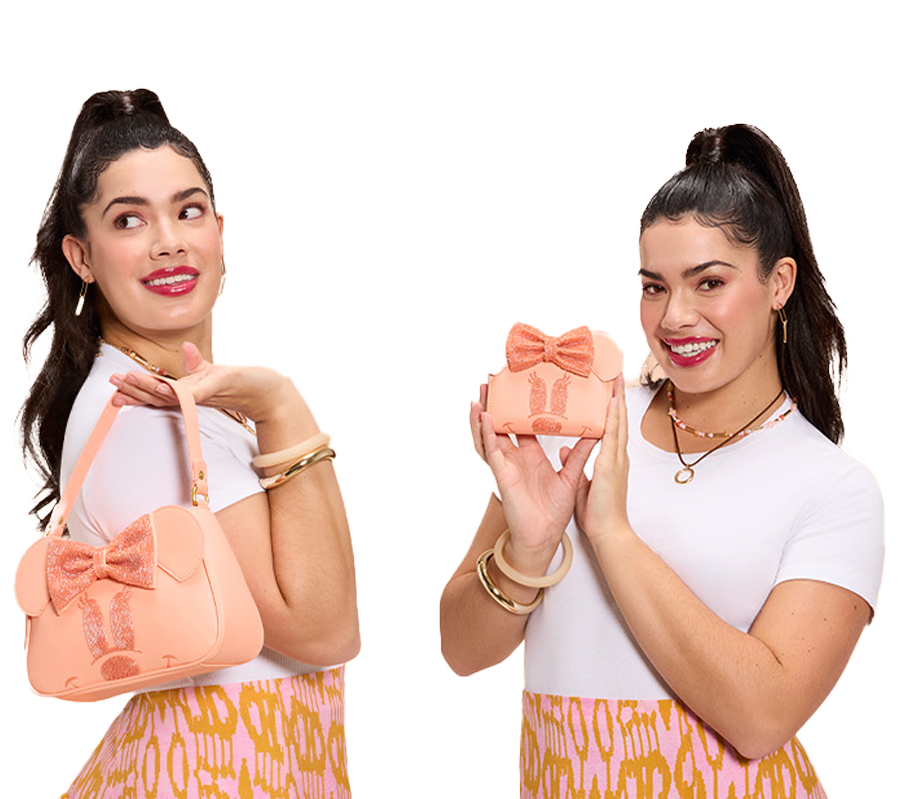 Model holding Loungefly Minnie Mouse accessories